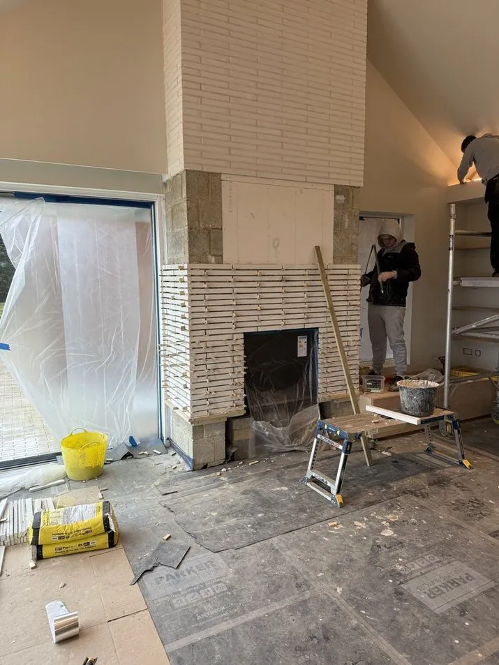 Brick feature wall with fireplace construction in Kent