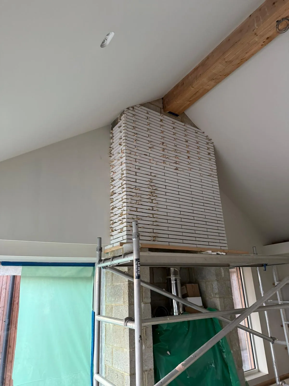 Feature brick wall with exposed beam interior in Kent