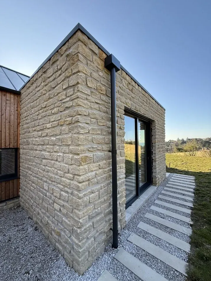 Modern stone extension with pathway in Kent