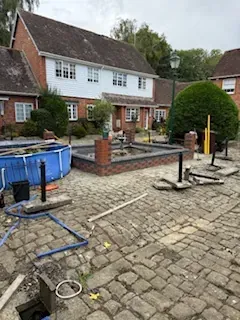 Brick fish pond with fountain in Kent - Built by Pros