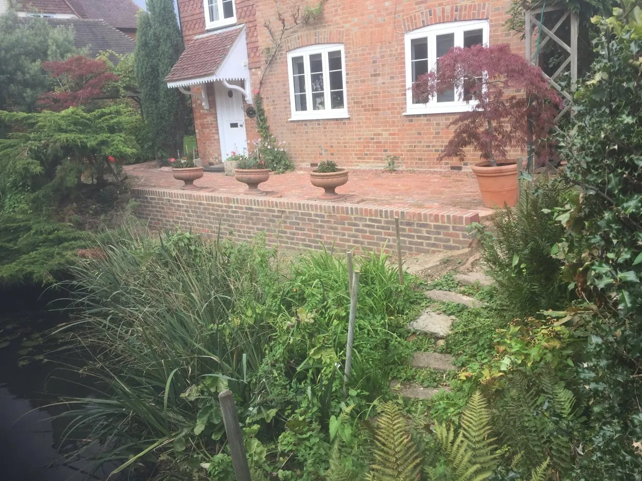 Brick retaining wall construction for pond feature in Kent