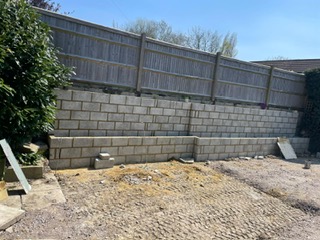 Brick retaining wall with raised garden bed Kent