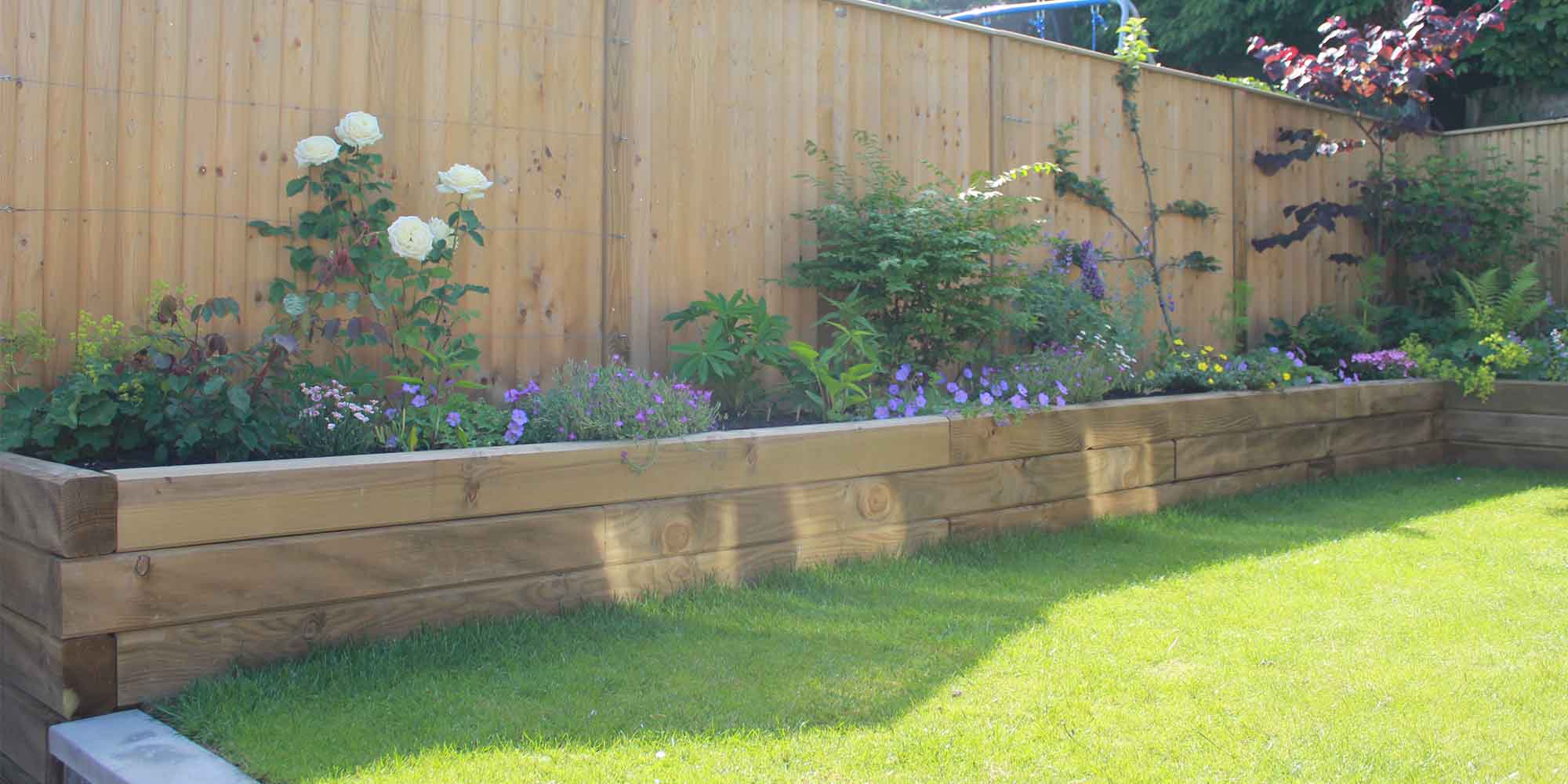 Timber sleeper raised garden bed installation Kent