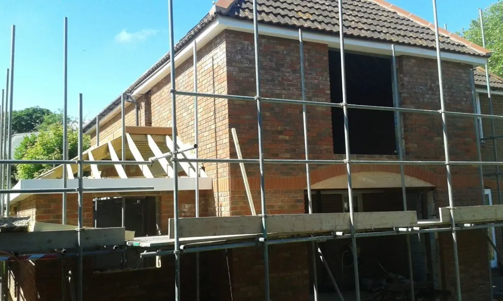 Two-story brick extension under construction in Ashford, Kent by Built by Pros