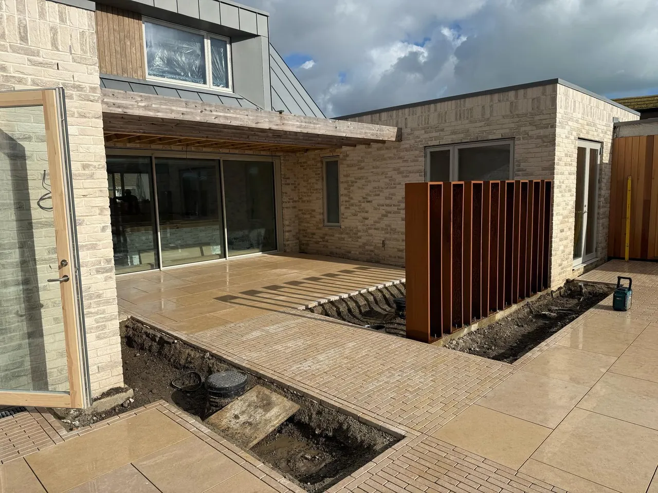 Modern patio with decking and block paving in Kent