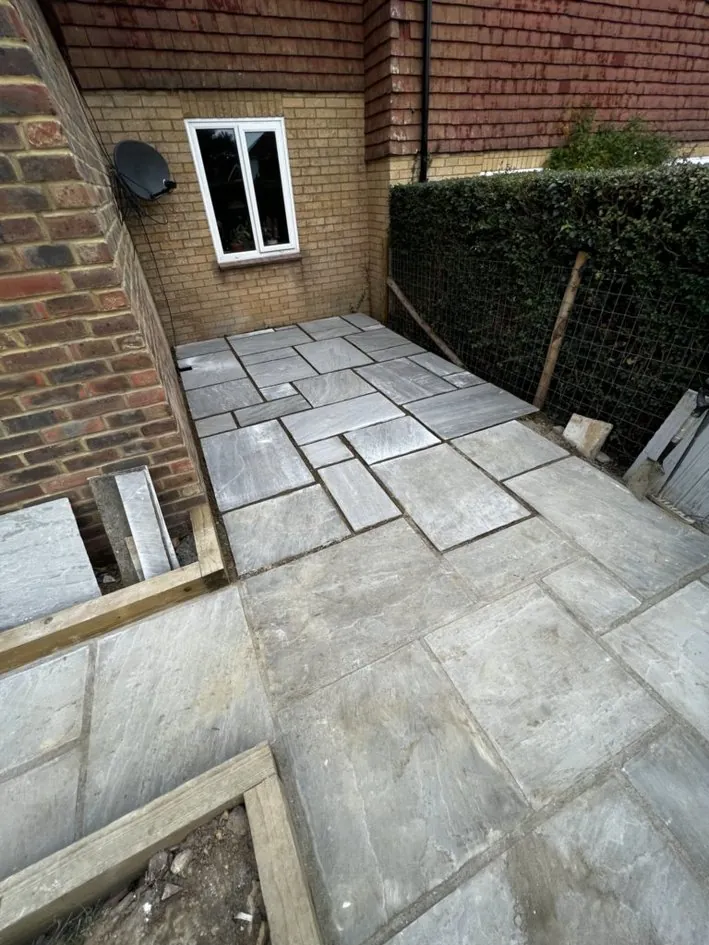 Natural stone patio installation in progress in Kent