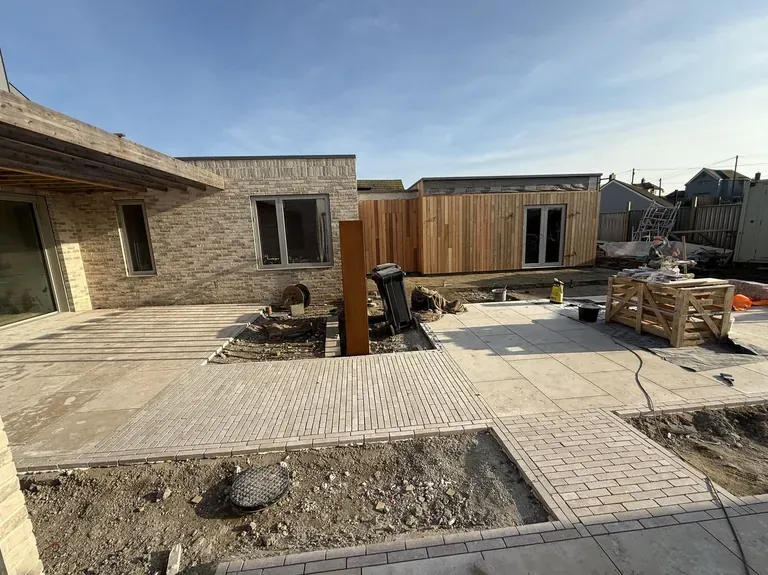 Patio with block paving and decking in Kent