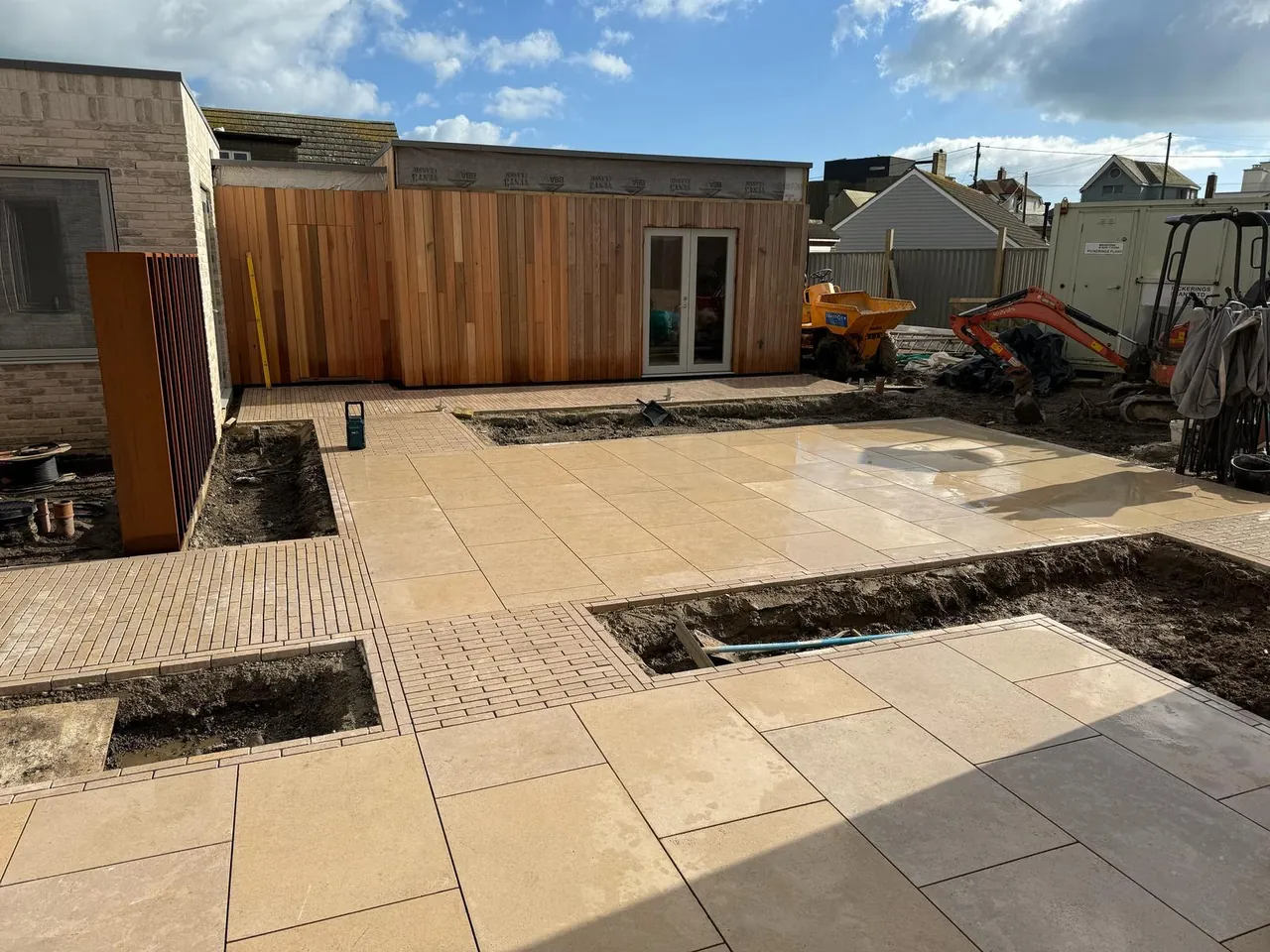 Porcelain patio with timber-clad extension in Kent